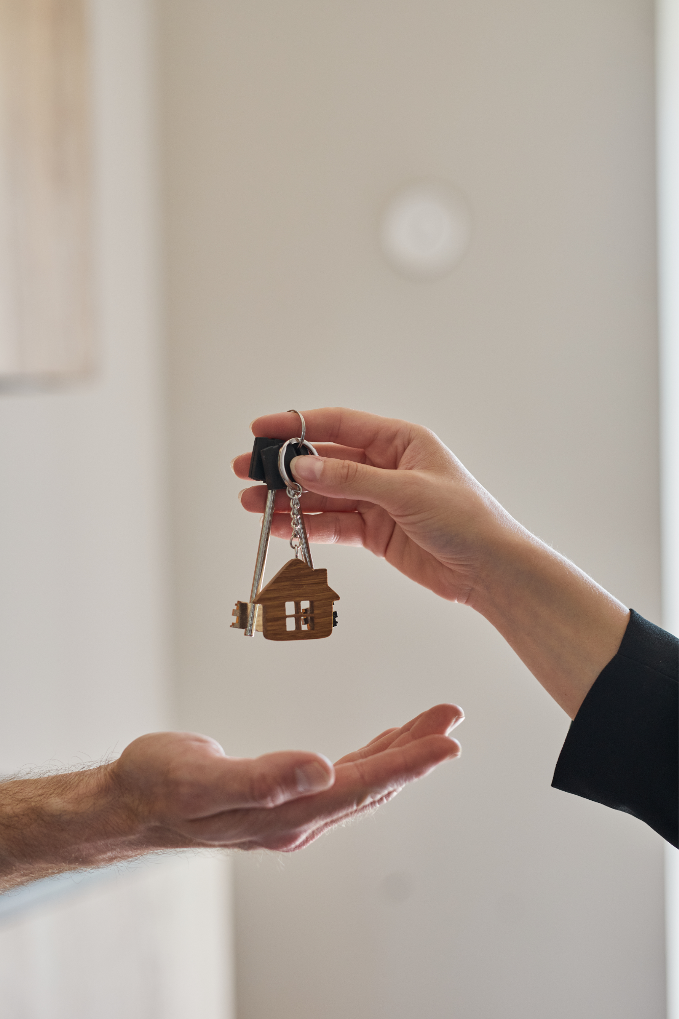 A new homeowner receiving house keys